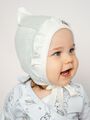 Белый трикотажный  ажурный чепчик уголком с с рюшей для новорожденных девочек Bebo